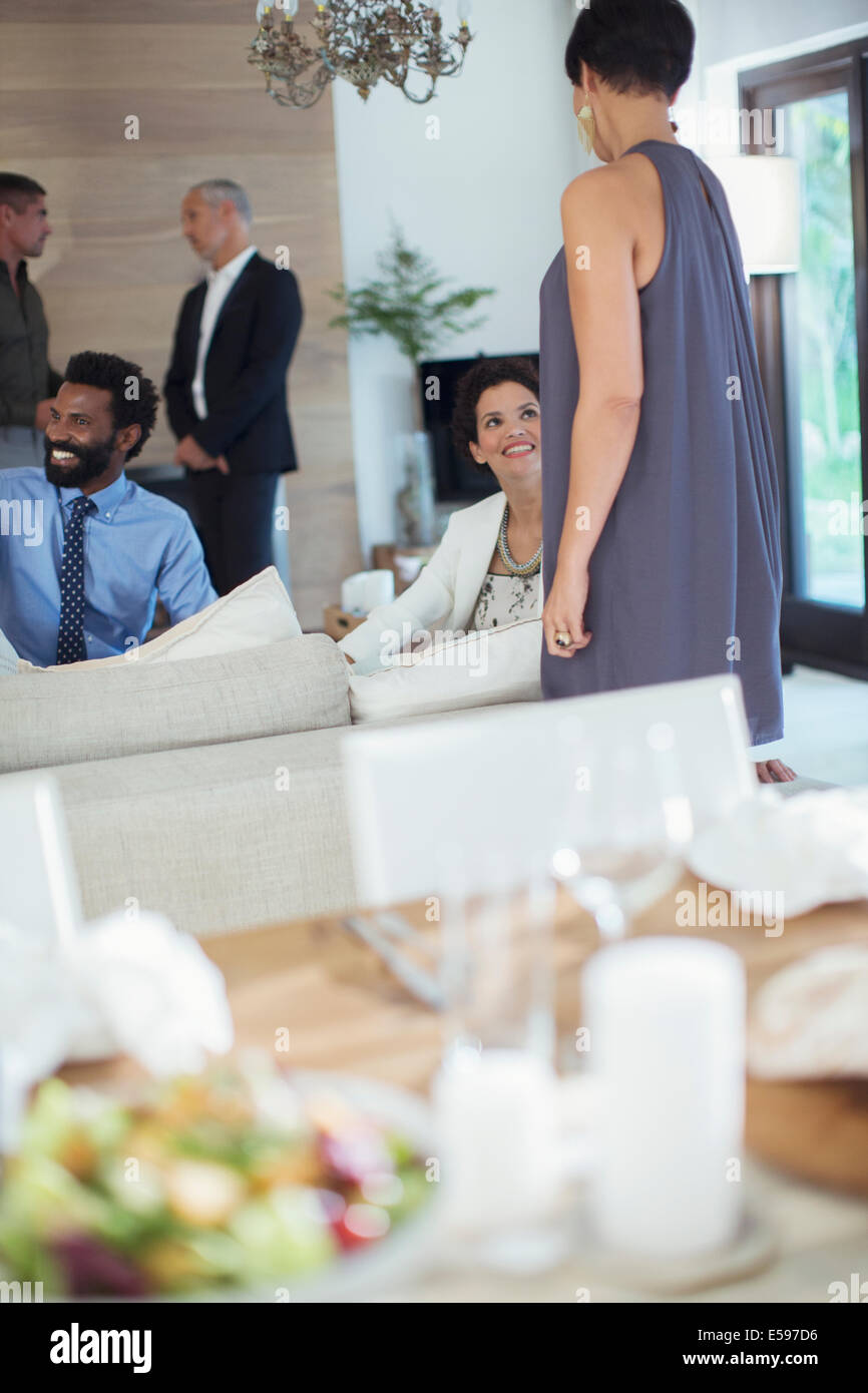 Friends relaxing at party Stock Photo