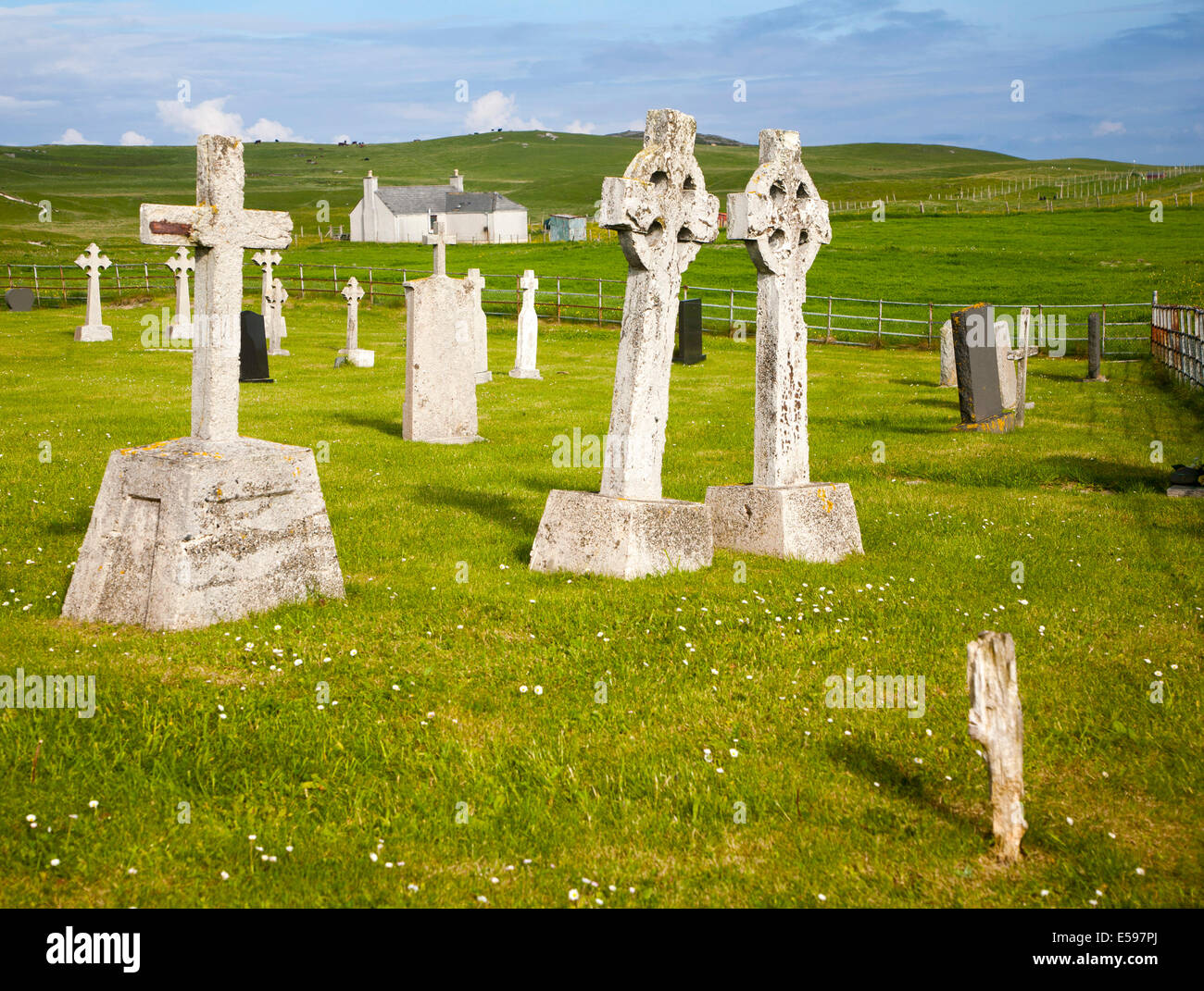 Gravestones in burial ground on Vatersay Island, Barra, Outer Hebrides, Scotland - two headstones leaning towards each other Stock Photo