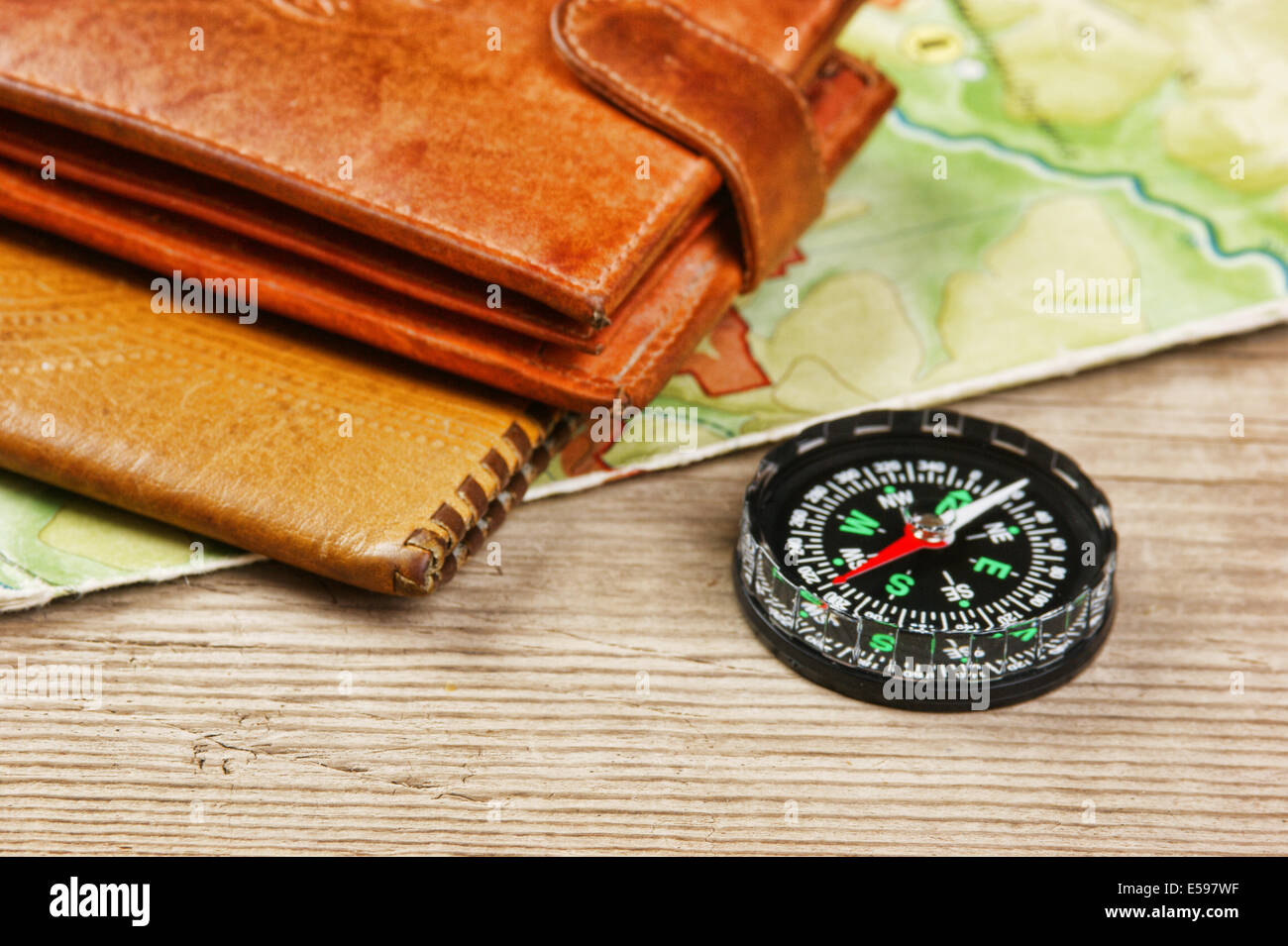 old map and compass on a wooden table Stock Photo - Alamy