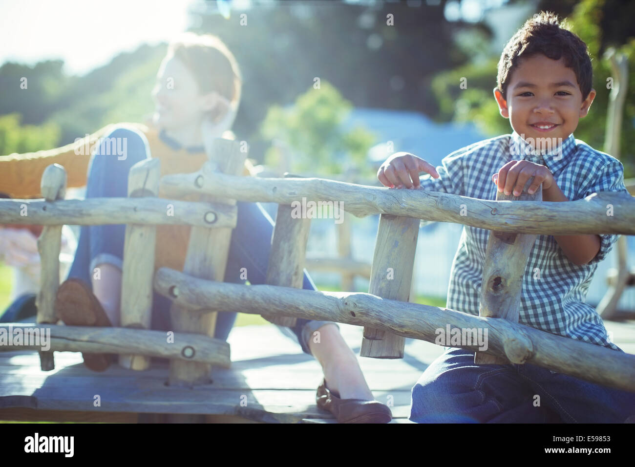 Teachers and students playing on play structure Stock Photo