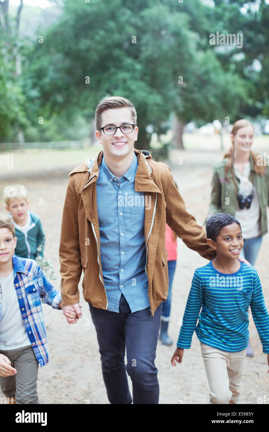 Students and teachers walking outdoors Stock Photo