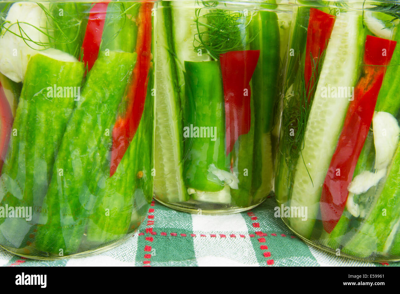 Jars of quick pickles with garlic, dill and red peppers Stock Photo Alamy