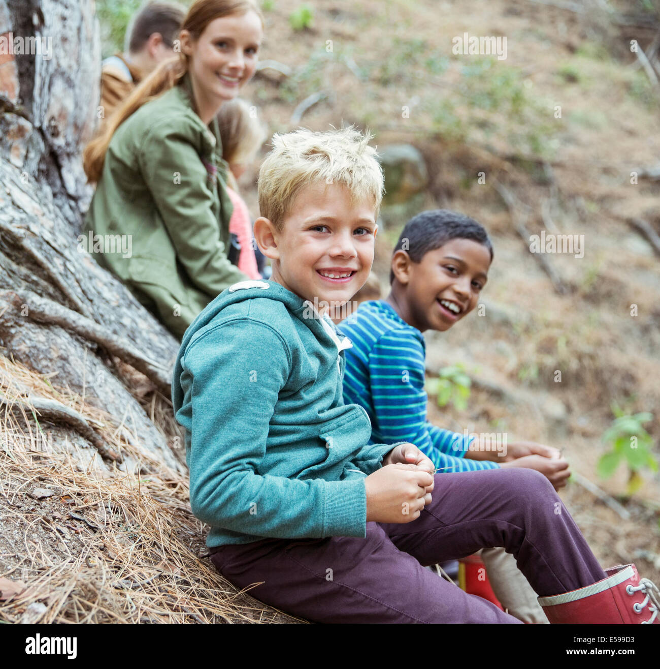 Students and teachers smiling in forest Stock Photo