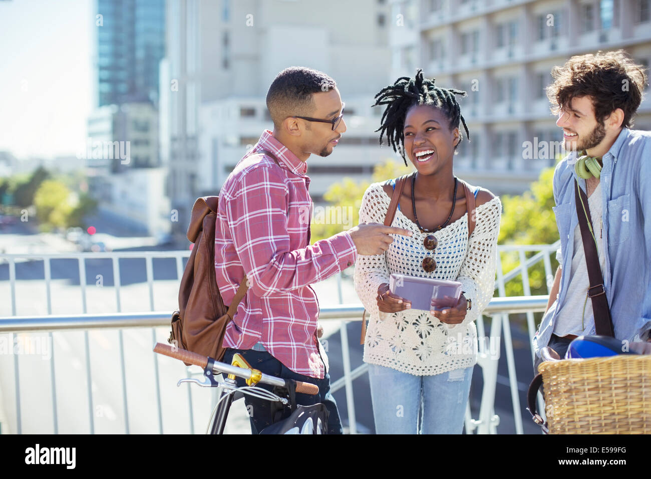 Group talking on street hi-res stock photography and images - Alamy