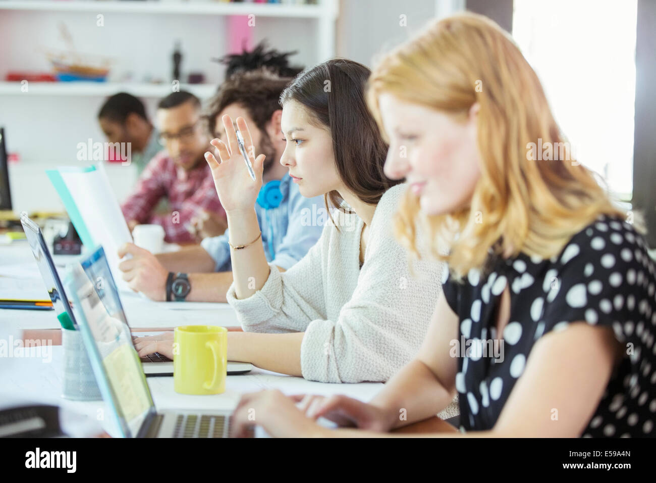 People working at conference table in office Stock Photo