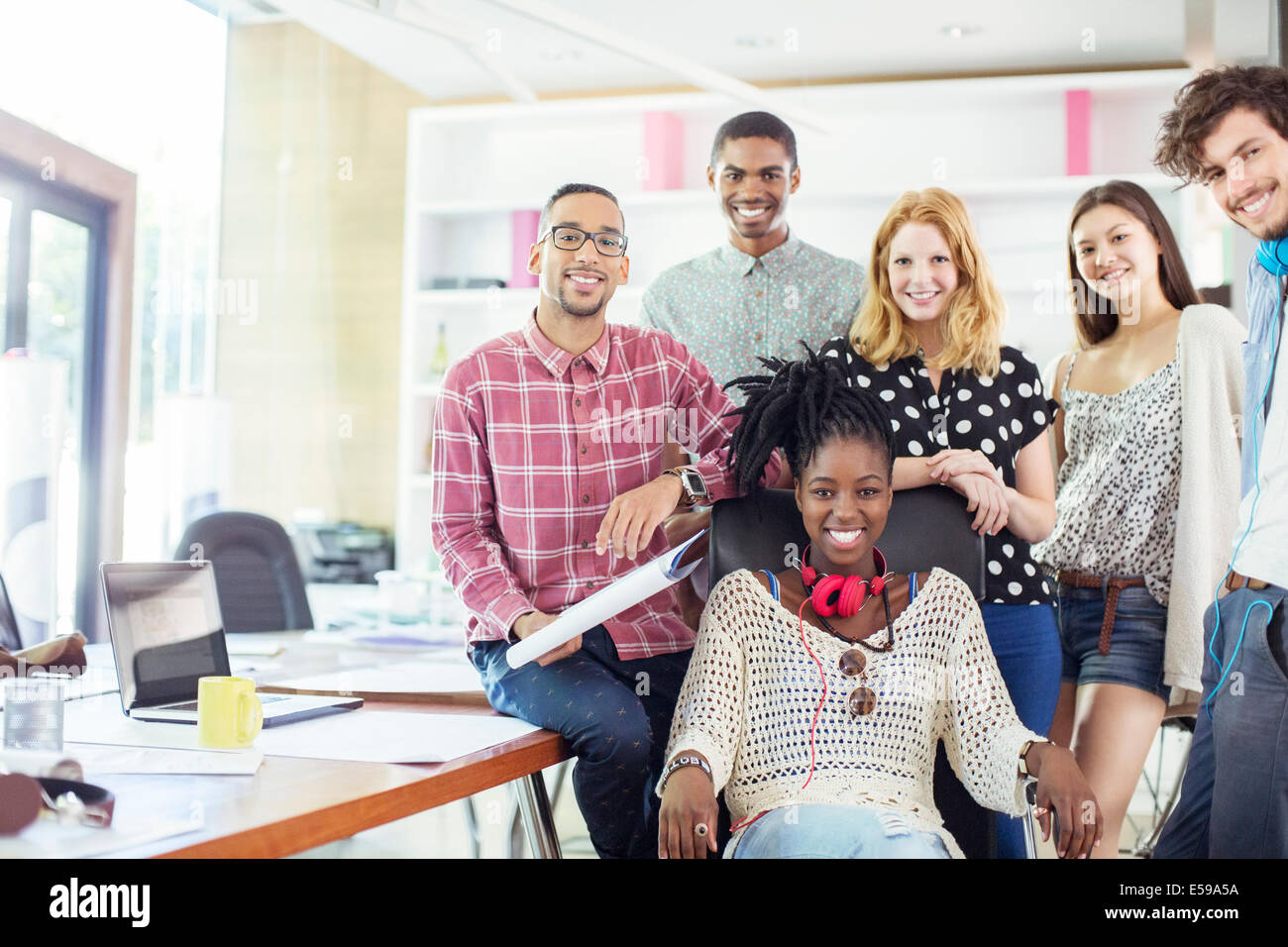 People smiling together in office Stock Photo