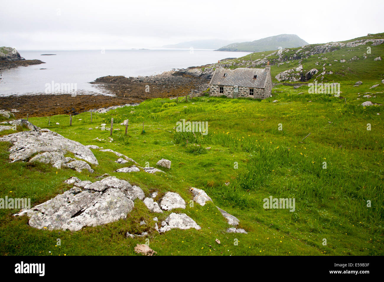 Deserted derelict croft cottage in coastal location at Port Deas an Uidhe, Vatersay Island, Barra, Outer, Hebrides, Scotland Stock Photo