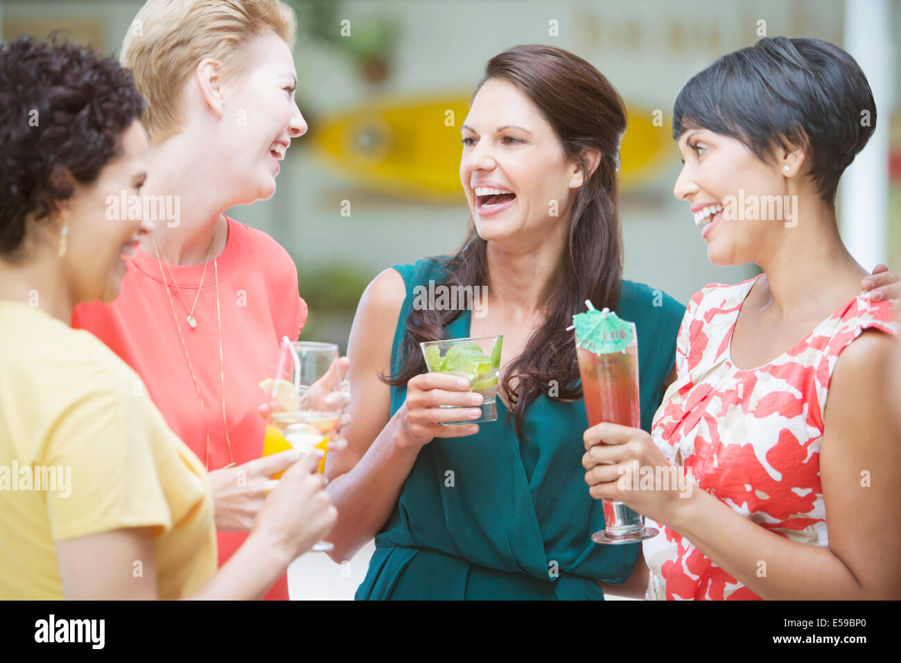 Women talking at party Stock Photo