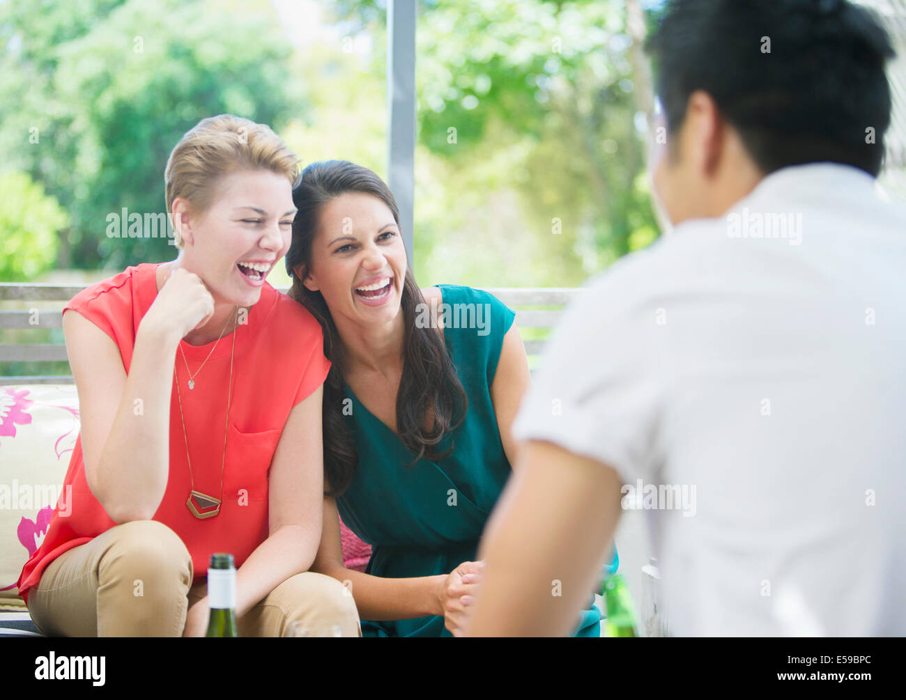 Women laughing at party Stock Photo