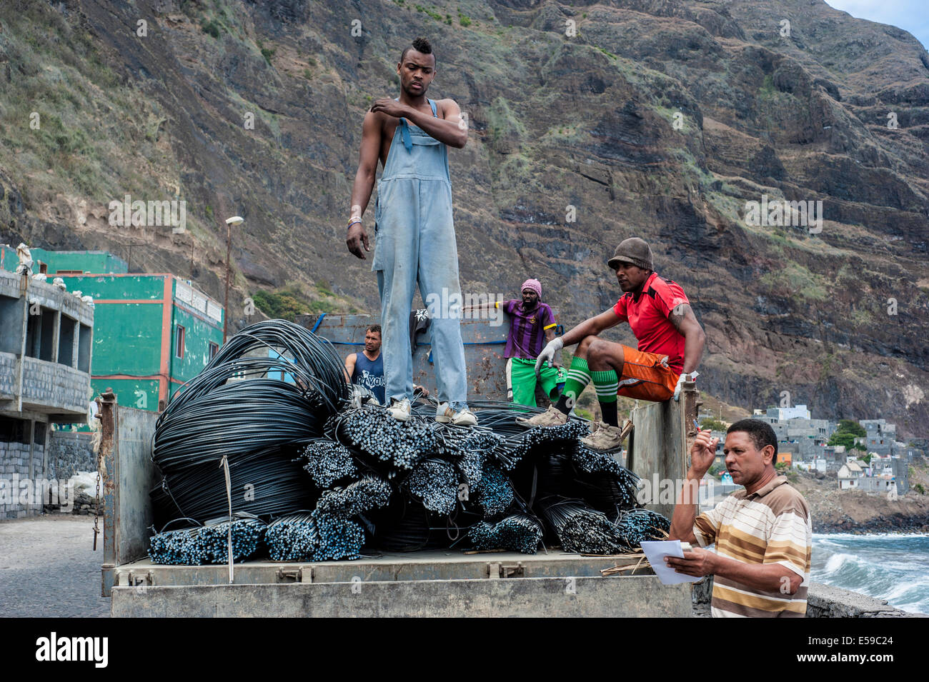 Workers unloading a heavy truck in village called Paul on Santo Antao Island, Cape Verde Stock Photo