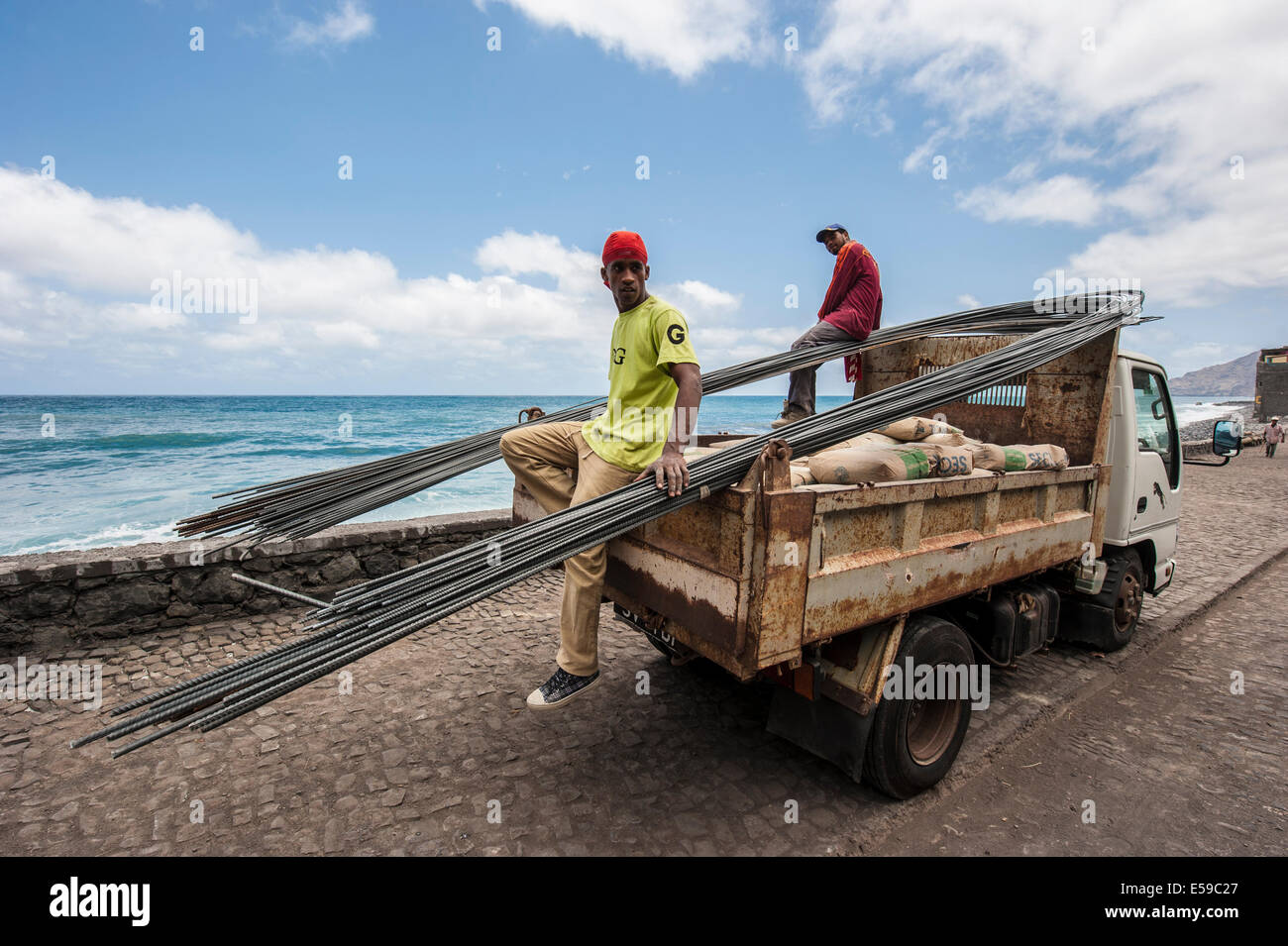 Workers unloading a heavy truck in village called Paul on Santo Antao Island, Cape Verde Stock Photo