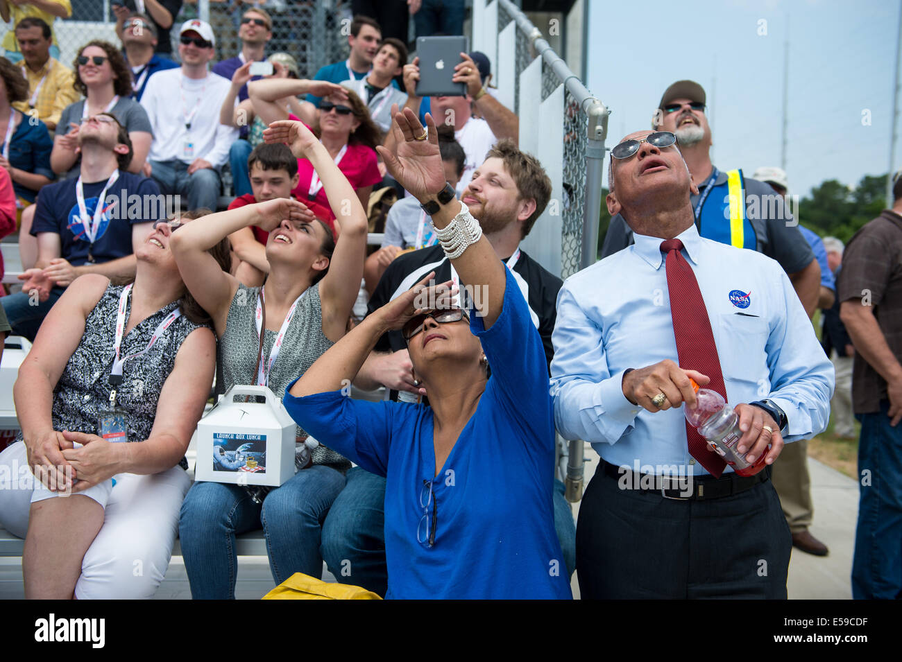 NASA Administrator Charles Bolden (right), his wife, Alexis Walker, and other guests watch the launch of the Orbital Sciences Corporation Antares rocket, with the Cygnus cargo spacecraft aboard, Sunday, July 13, 2014, at NASA’s Wallops Flight Facility in Stock Photo