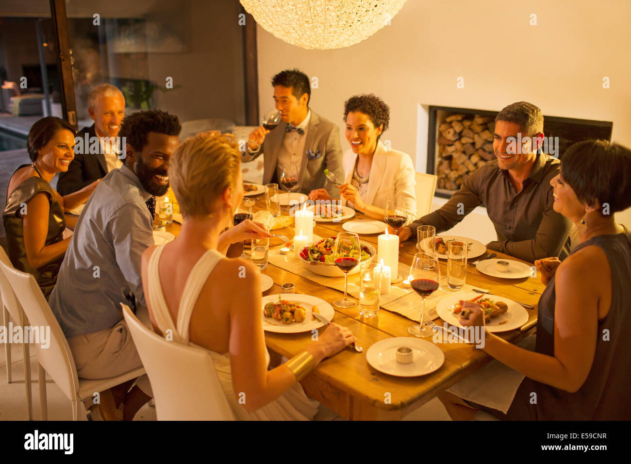 Friends talking at dinner party Stock Photo