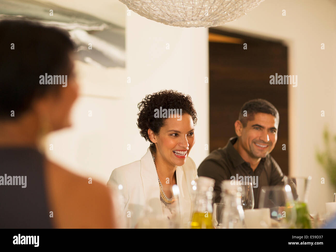 Friends talking at dinner party Stock Photo