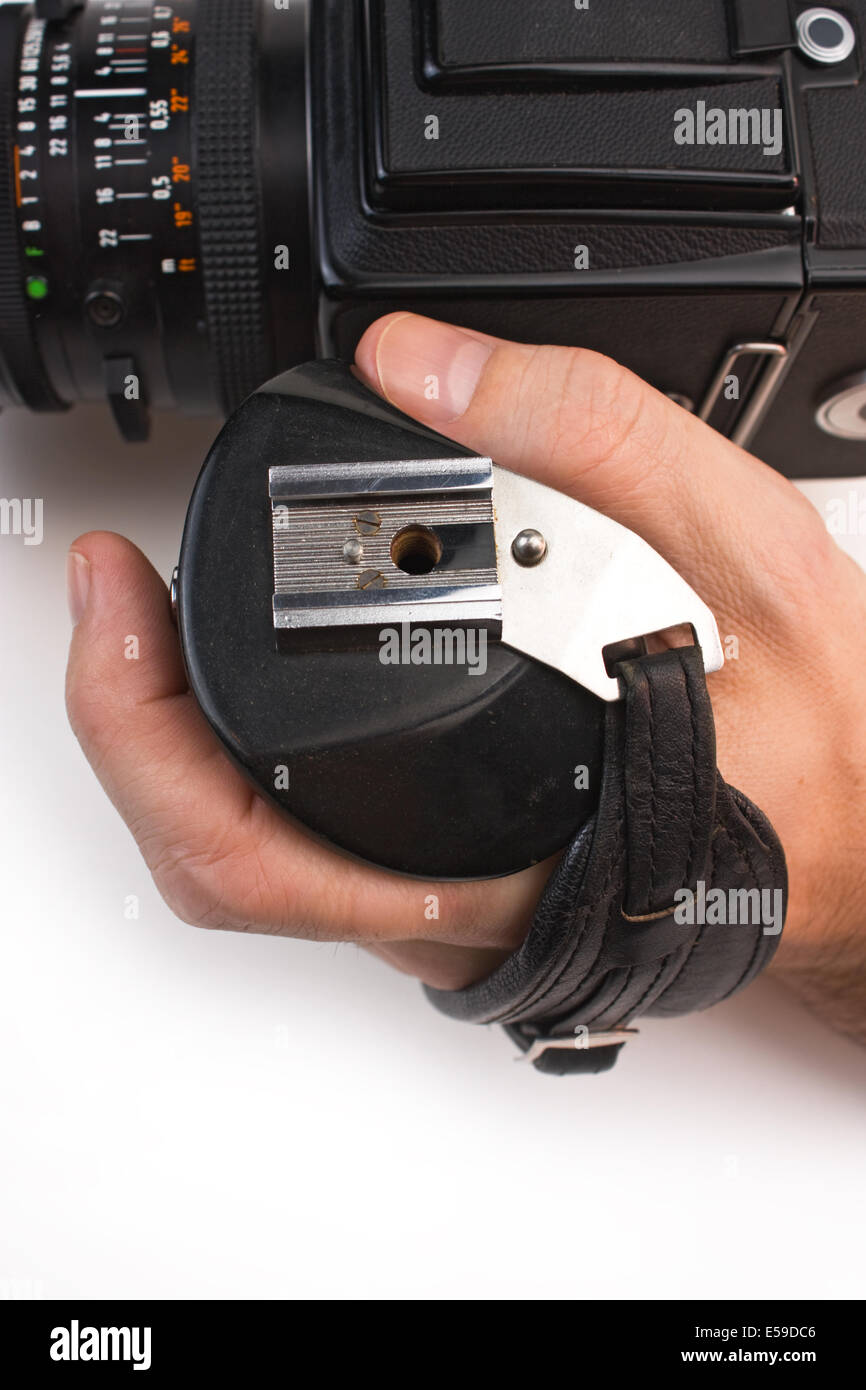 hand holds the handle of the camera isolated on white background Stock ...