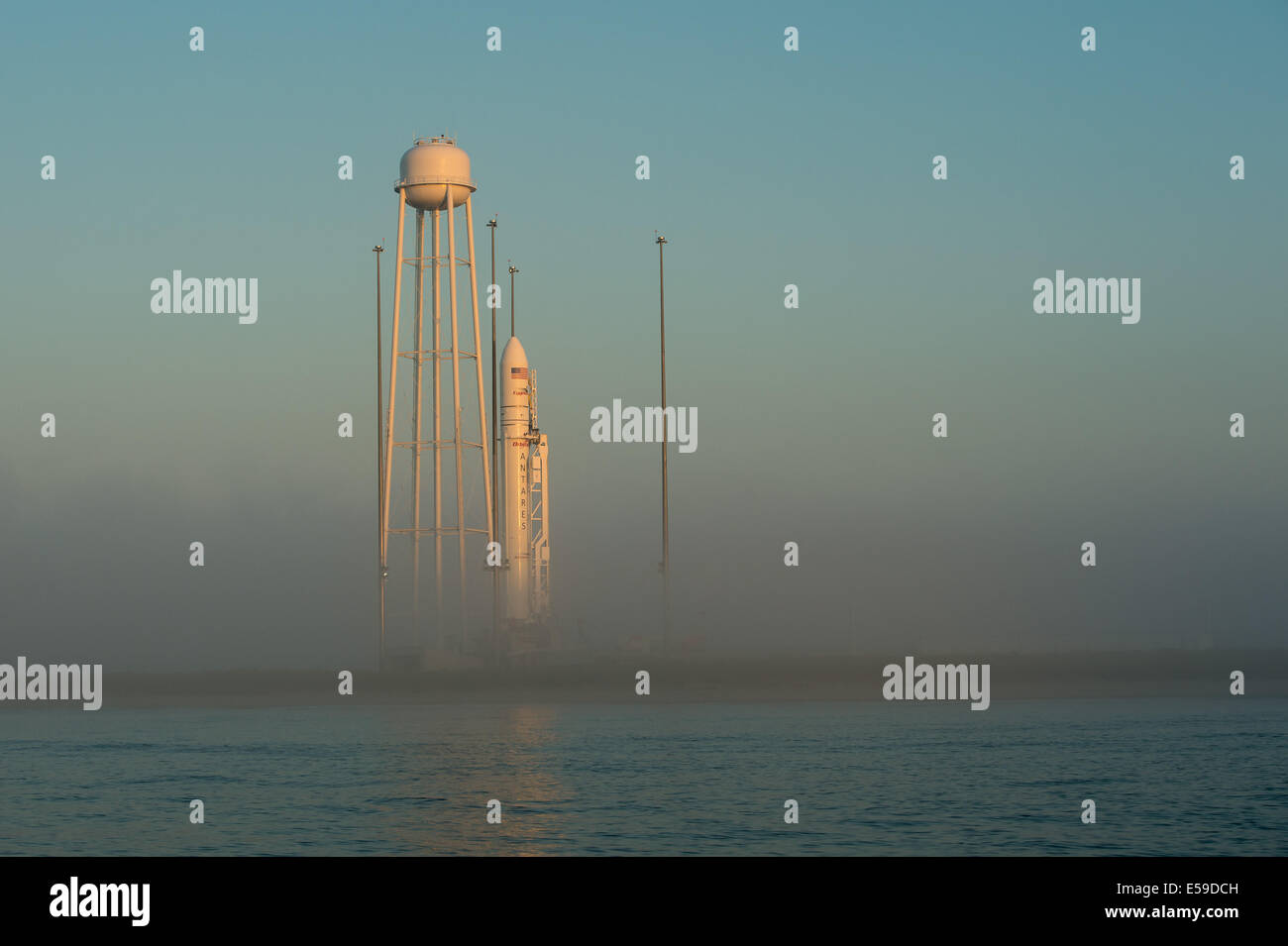 The Orbital Sciences Corporation Antares rocket, with the Cygnus spacecraft onboard, is seen during sunrise, Saturday, July 12, 2014, at launch Pad-0A of NASA's Wallops Flight Facility in Virginia. The Antares will launch with the Cygnus spacecraft filled Stock Photo