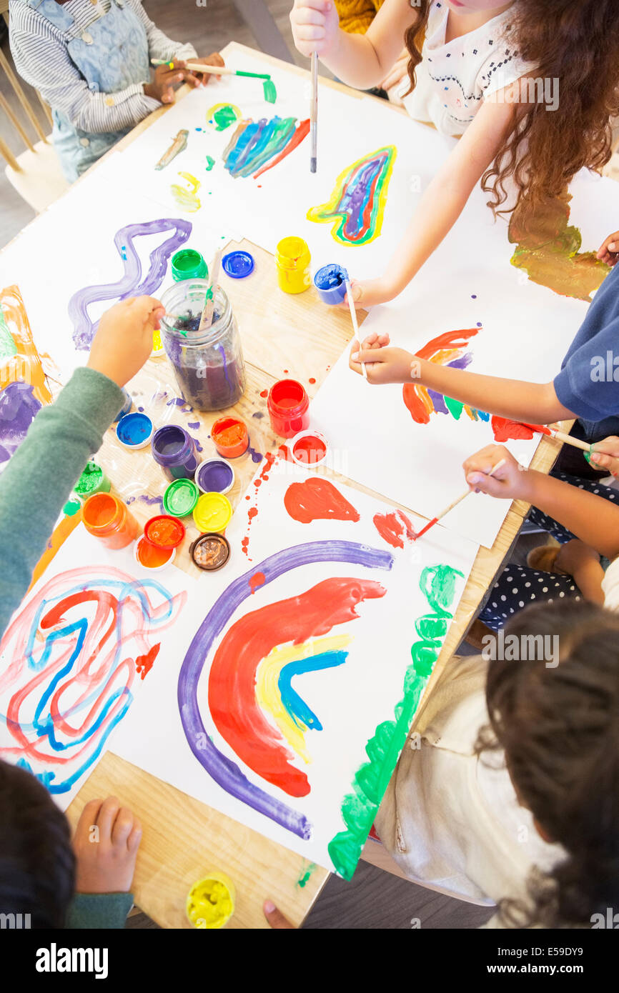 Students painting in classroom Stock Photo