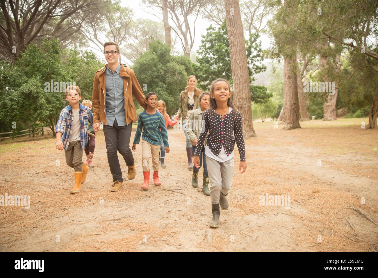 Students and teachers walking outdoors Stock Photo