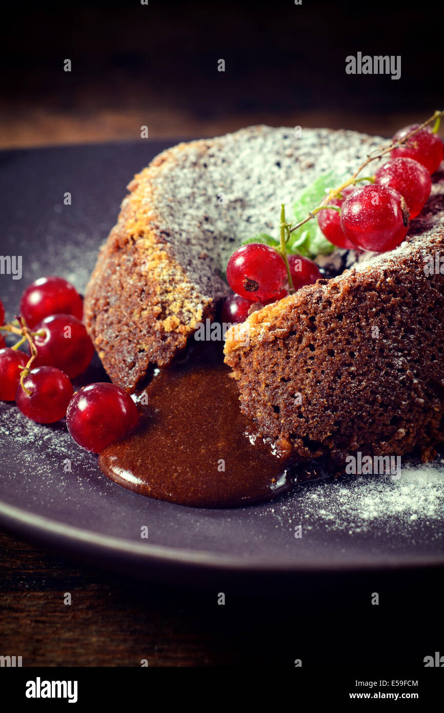 Sweet lava cake stuffed with melted chcocolate in the plate Stock Photo