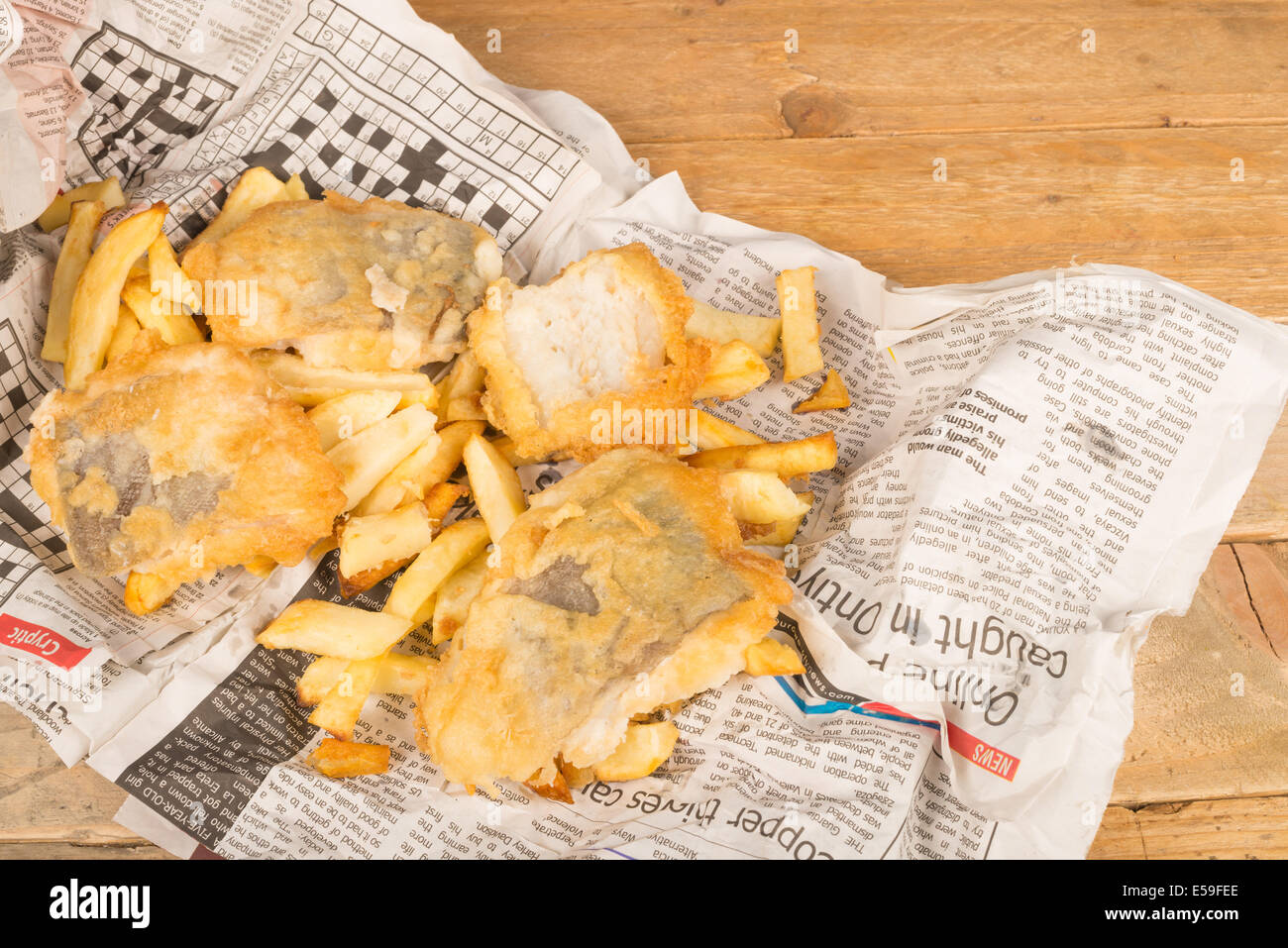 Fish and chips on their traditional newspaper wrap Stock Photo Alamy
