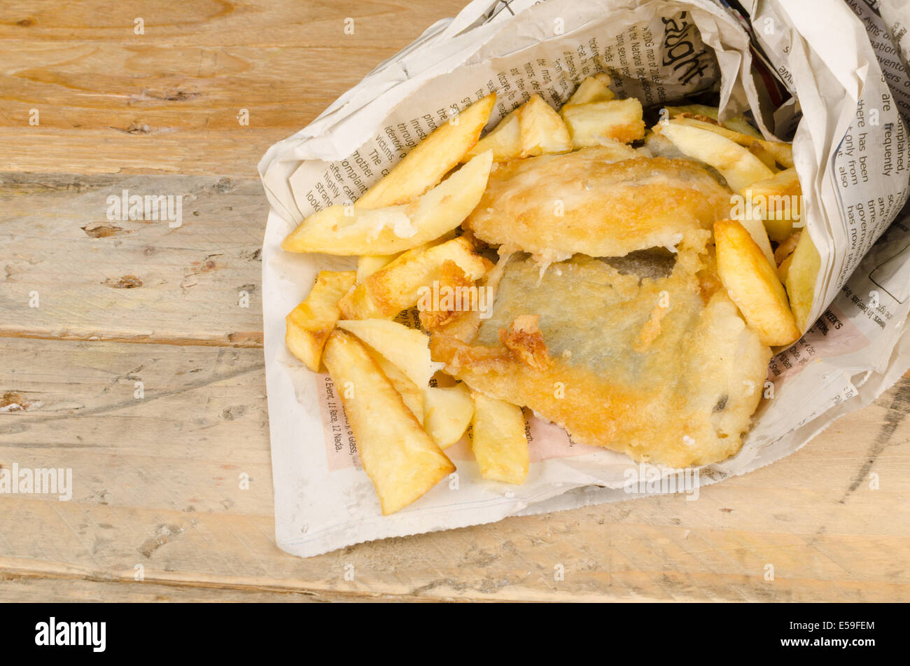 Traditional fish and chips wrapped in a newspaper cone Stock Photo Alamy
