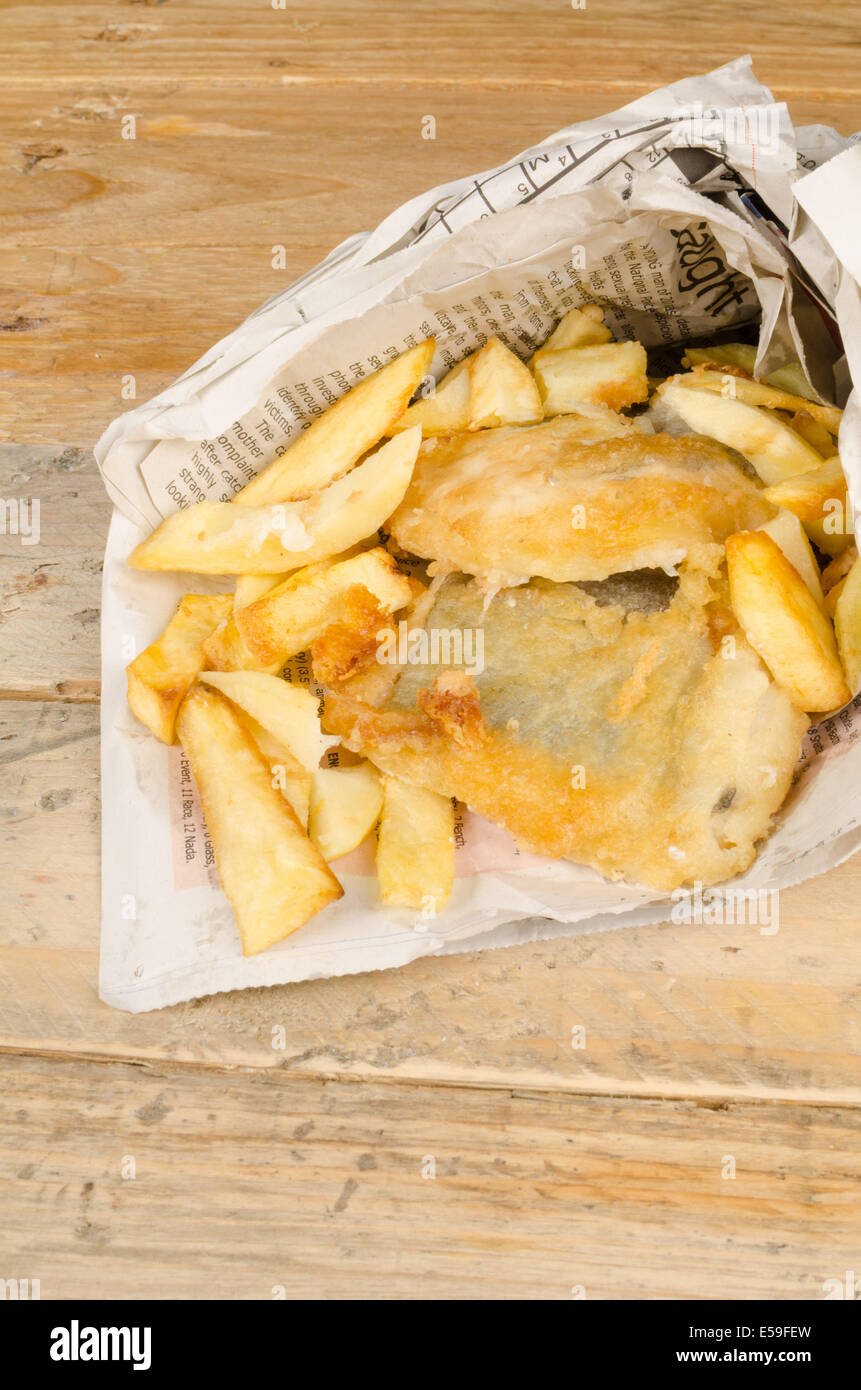 Traditional fish and chips wrapped in a newspaper cone Stock Photo Alamy