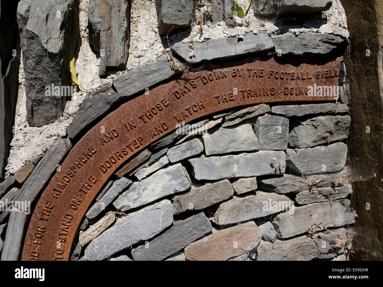 Inscription on wall by path running through Garw valley Stock Photo