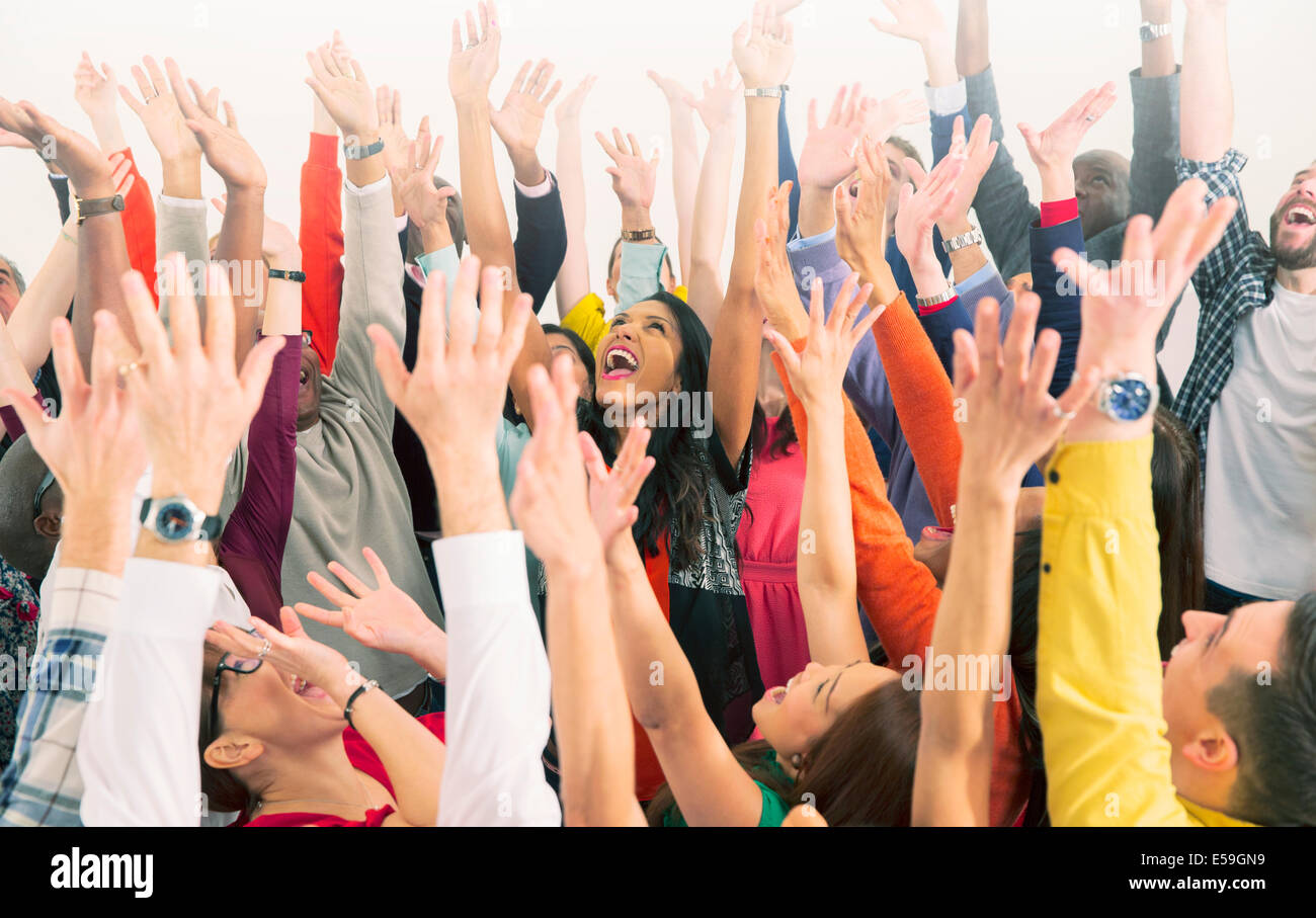 Enthusiastic crowd cheering Stock Photo