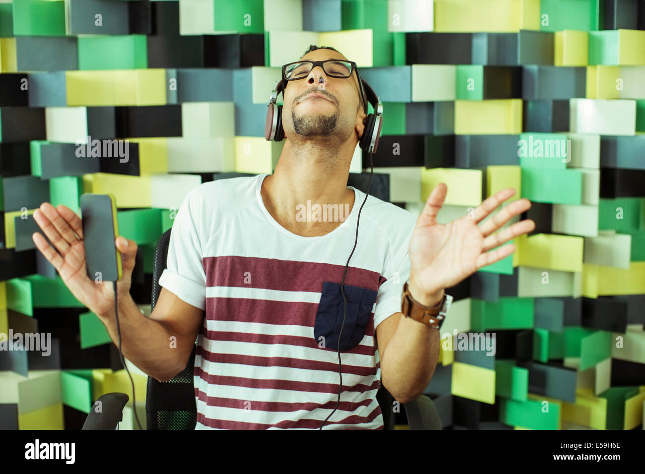 Man listening to headphones Stock Photo