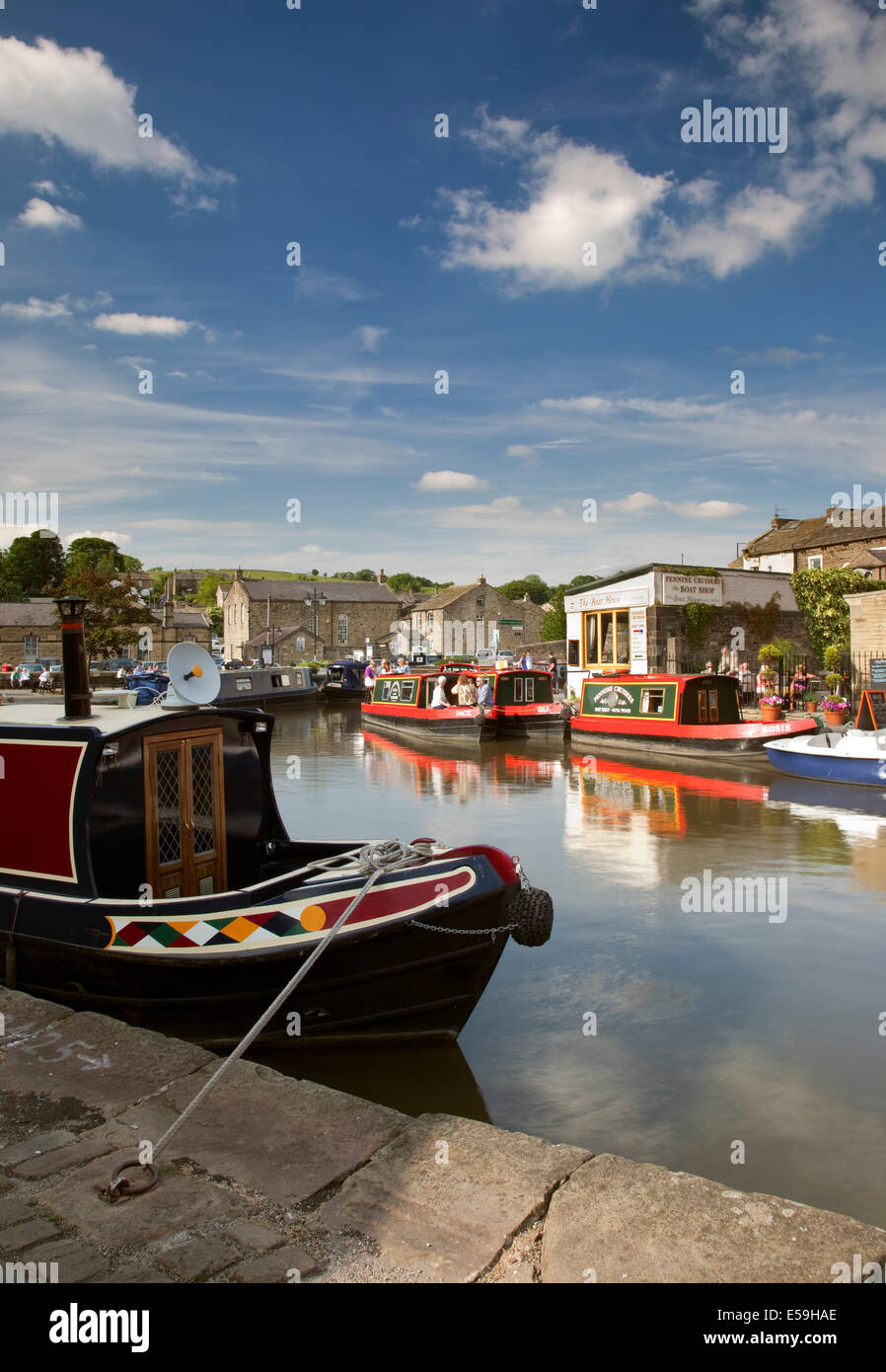 Colourful barges moored at Skipton Canal Basin in Yorkshire. Stock Photo