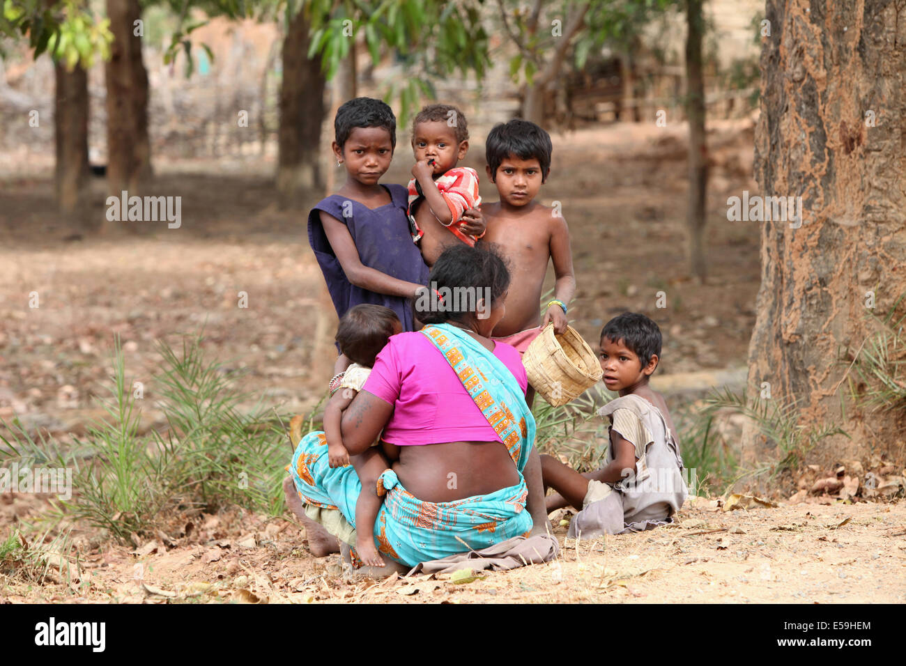 Gond woman with children in the Forest, Kongara Village, Chattisgadh, India Stock Photo