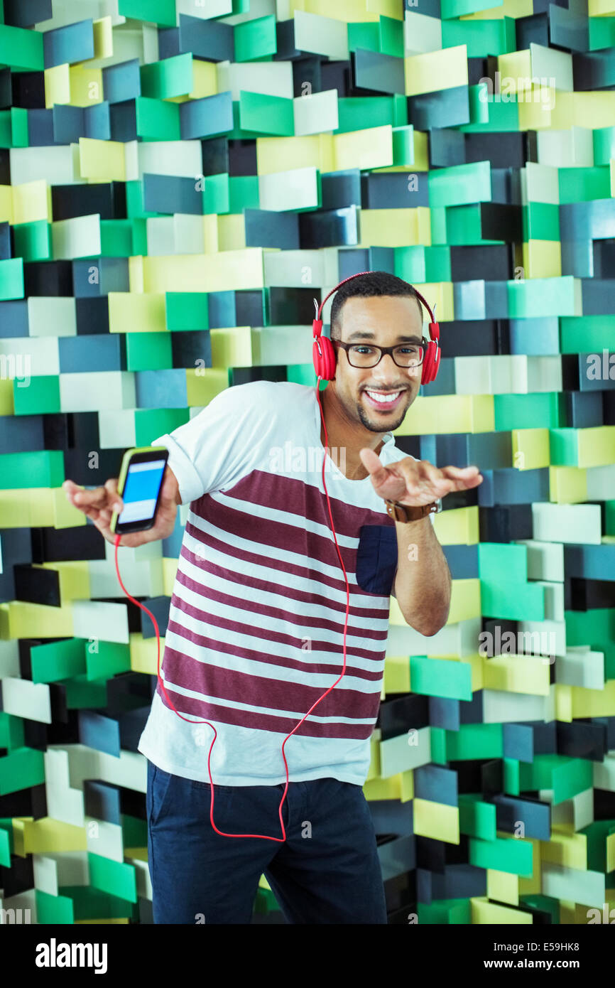 Man dancing to mp3 player Stock Photo