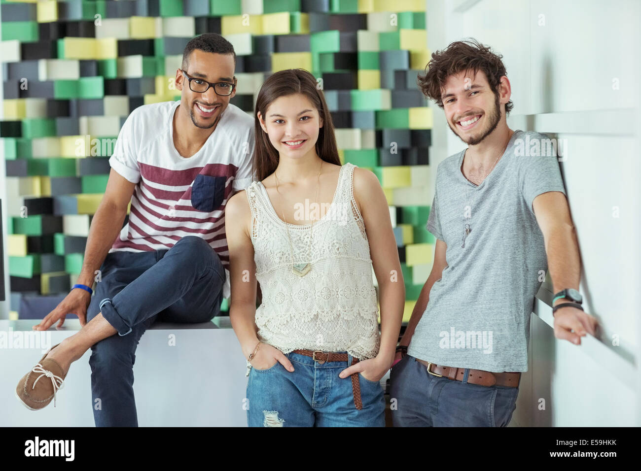 People smiling together in office Stock Photo