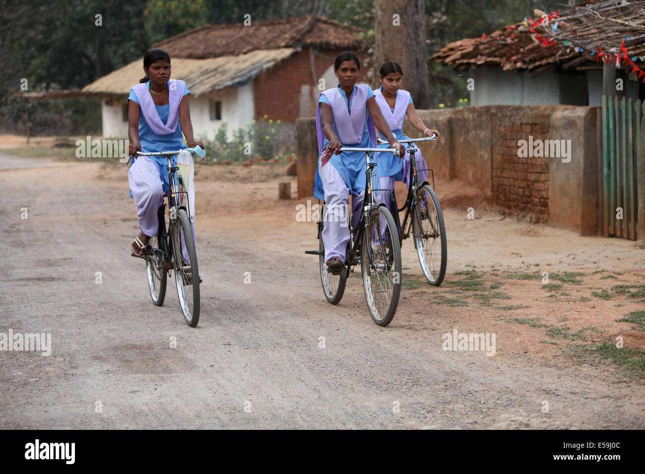 School girls riding bicycle, Kodopali Village, Chattisgadh, India Stock Photo