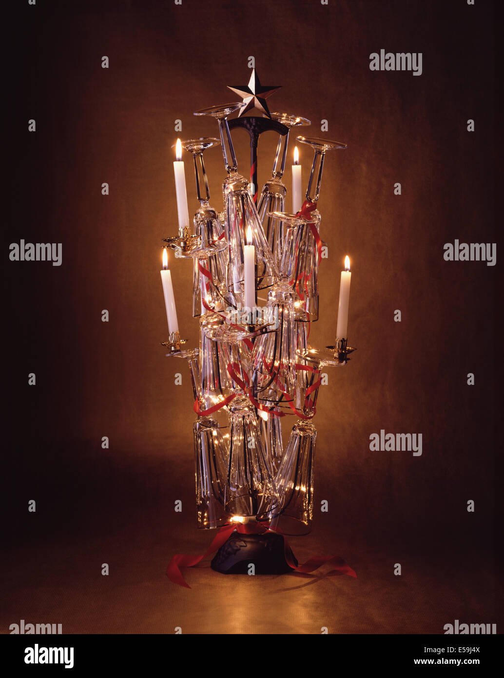 A Cast Iron Glass Tree Holder With Ralph Lauren Champagne Flutes On It With Red Ribbon Intertwined Between Them And Lit White C Stock Photo Alamy