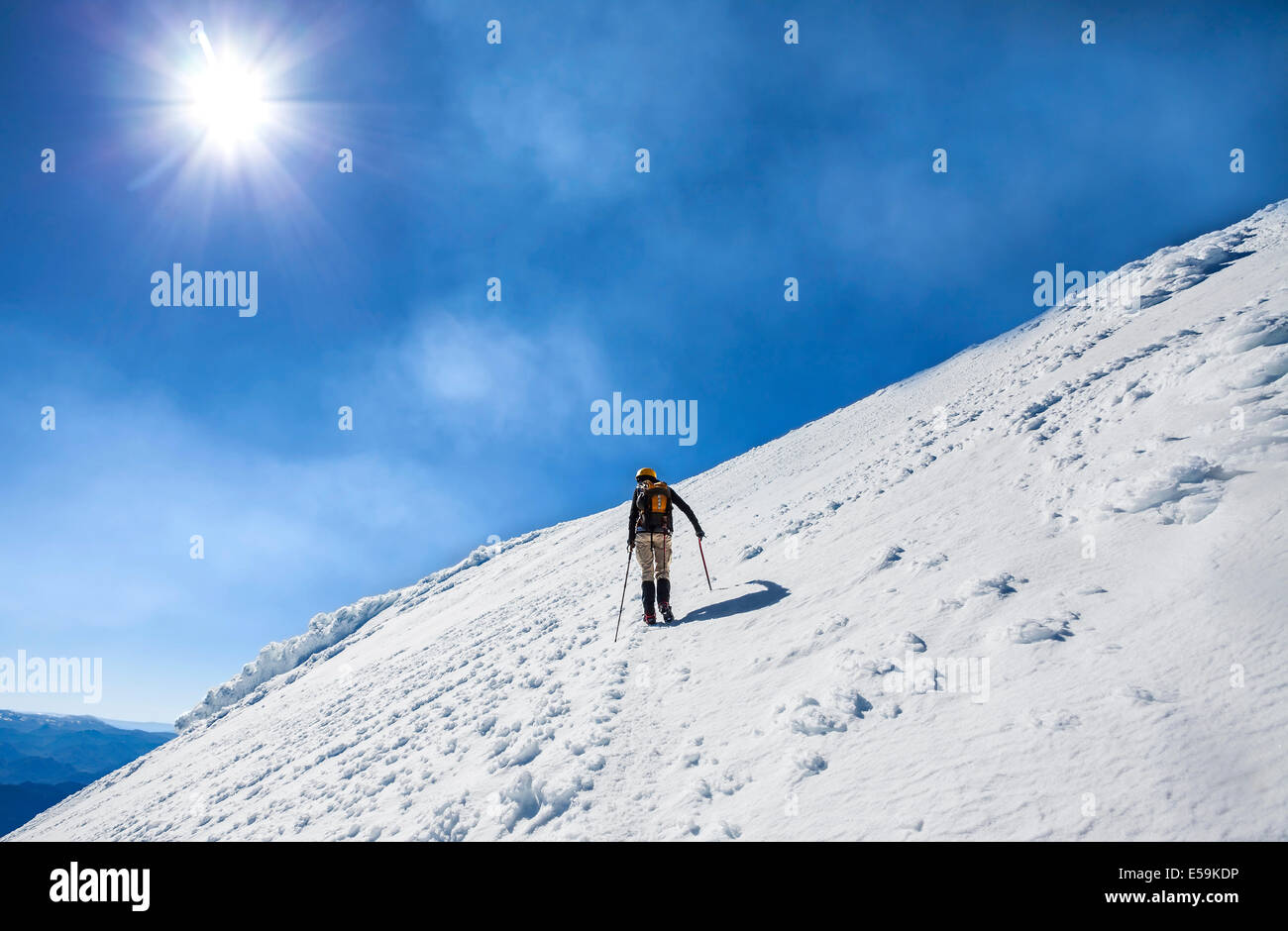 Climber on the way to the top of an active volcano Villarica in Chile. Stock Photo
