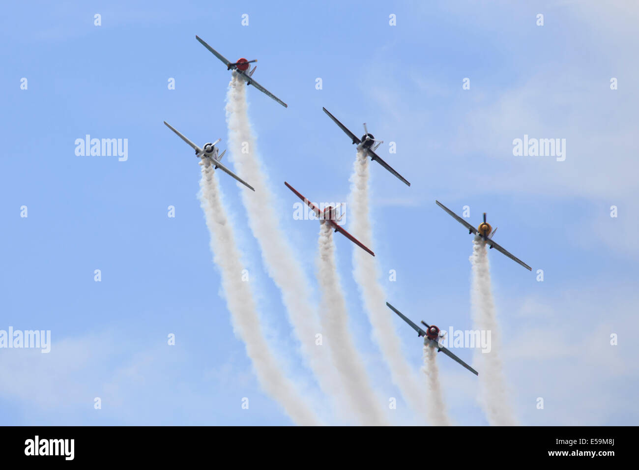 The 'Aerostars' aerobatic team perform at 2014 Farnborough Airshow in ...