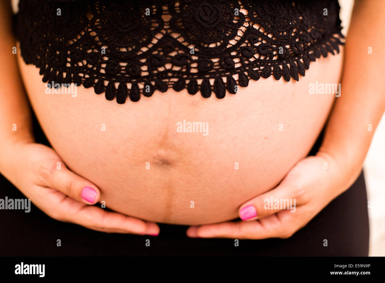 Pregnant young woman on last month of pregnancy. Stock Photo