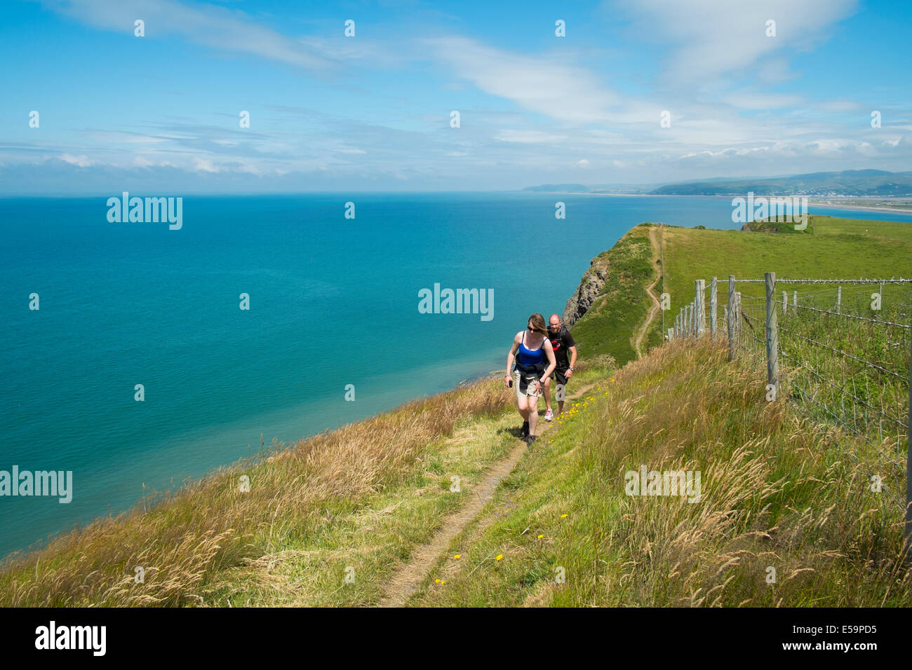 Walkers on the West Coast Path near Borth, Ceredigion, Wales. Stock Photo
