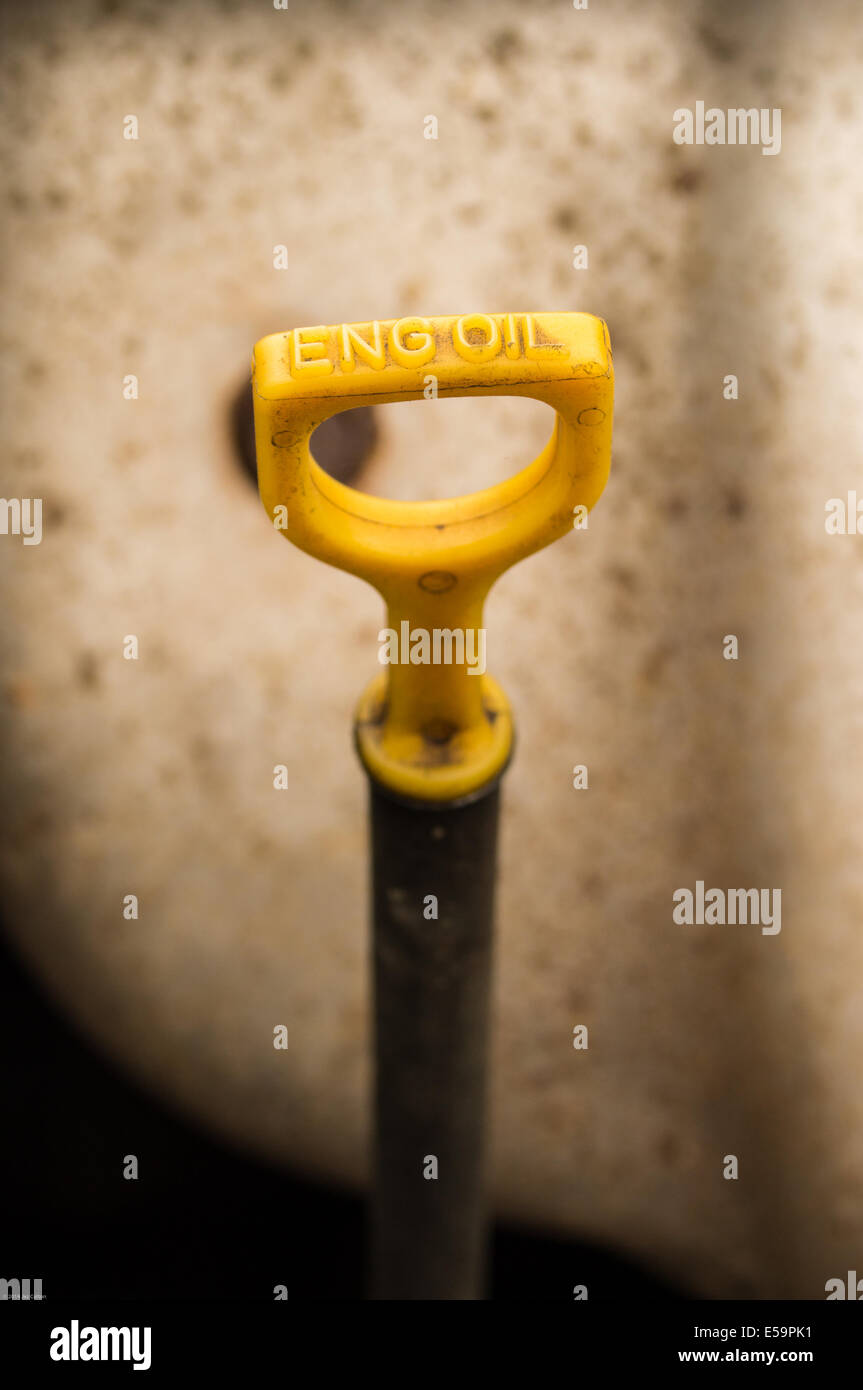 A yellow dipstick handle on a engine Stock Photo Alamy