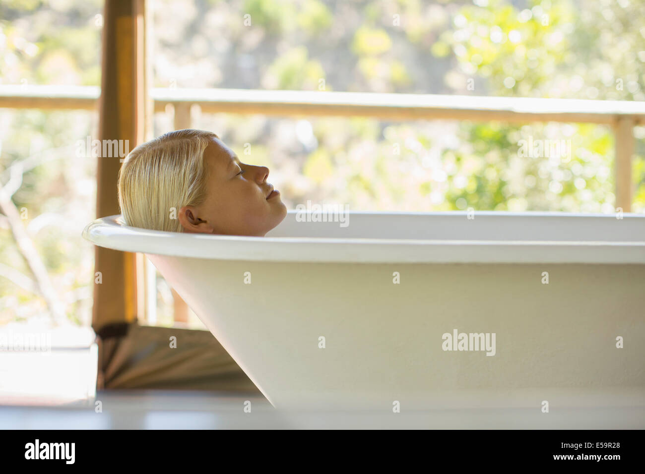 Relaxing woman in bathtub hi-res stock photography and images - Alamy