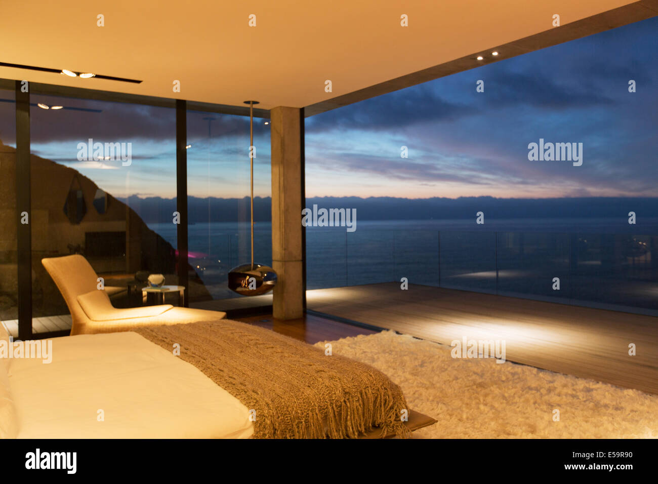 Modern bedroom overlooking ocean Stock Photo Alamy