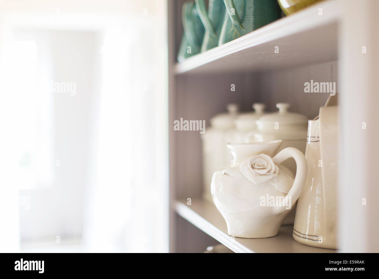 Close up of ceramics on kitchen shelf Stock Photo