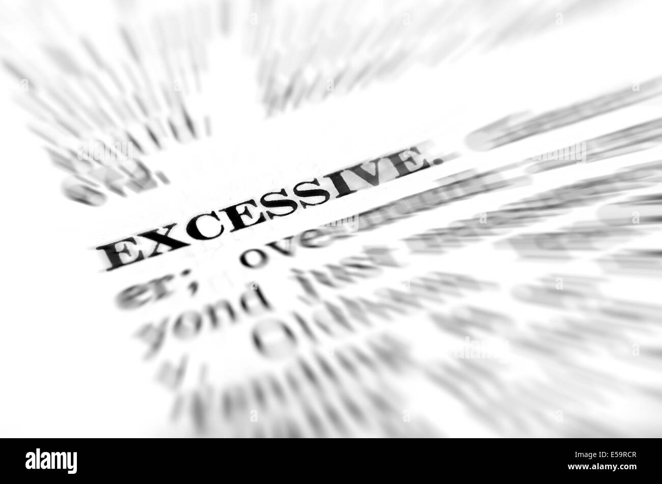 Closeup of definition of excessive from dictionary Stock Photo