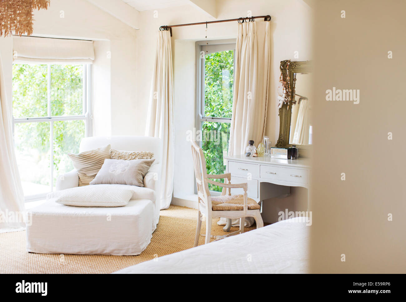 Armchair and vanity in rustic bedroom Stock Photo Alamy