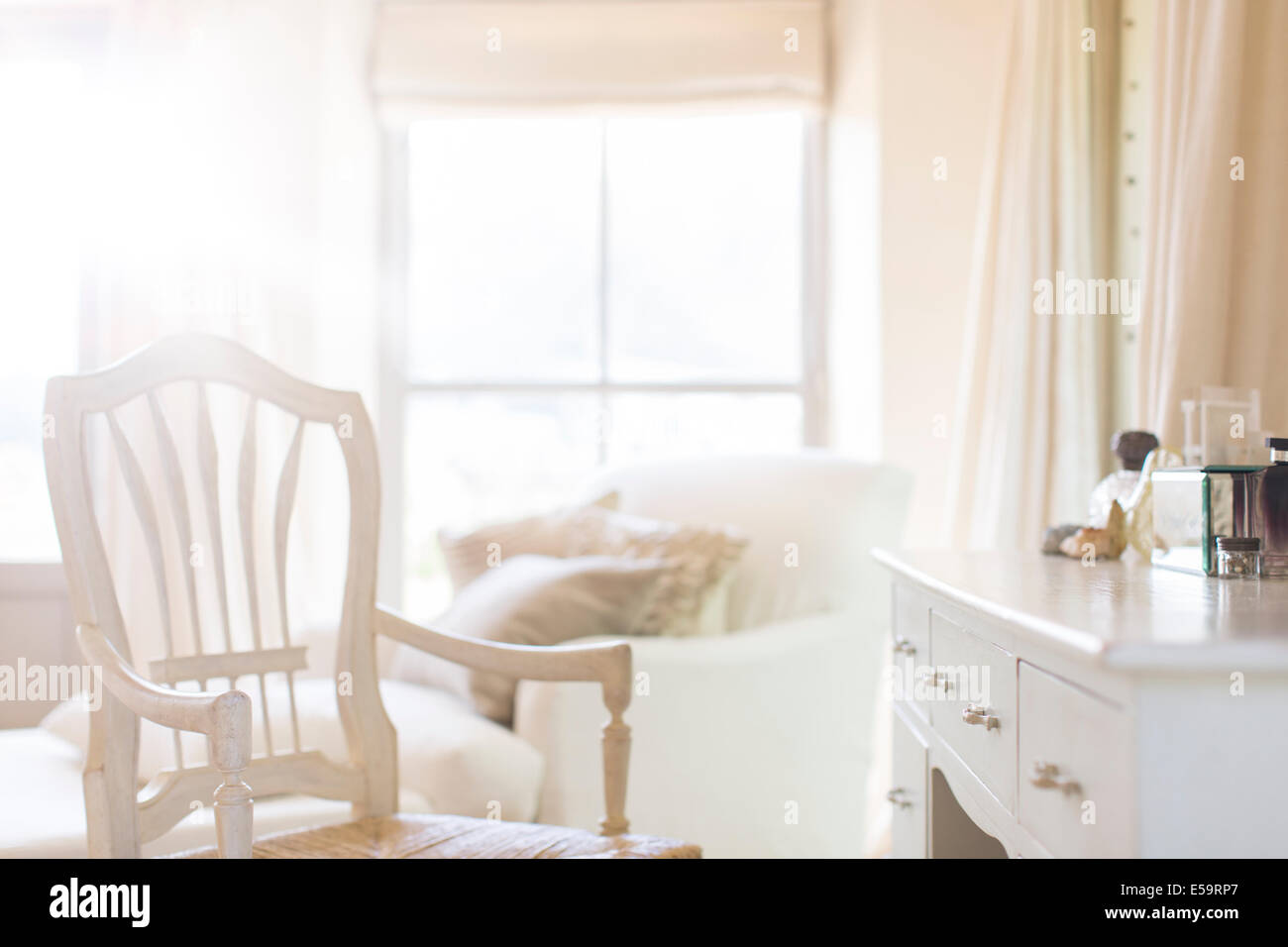 Armchair at vanity of rustic house Stock Photo