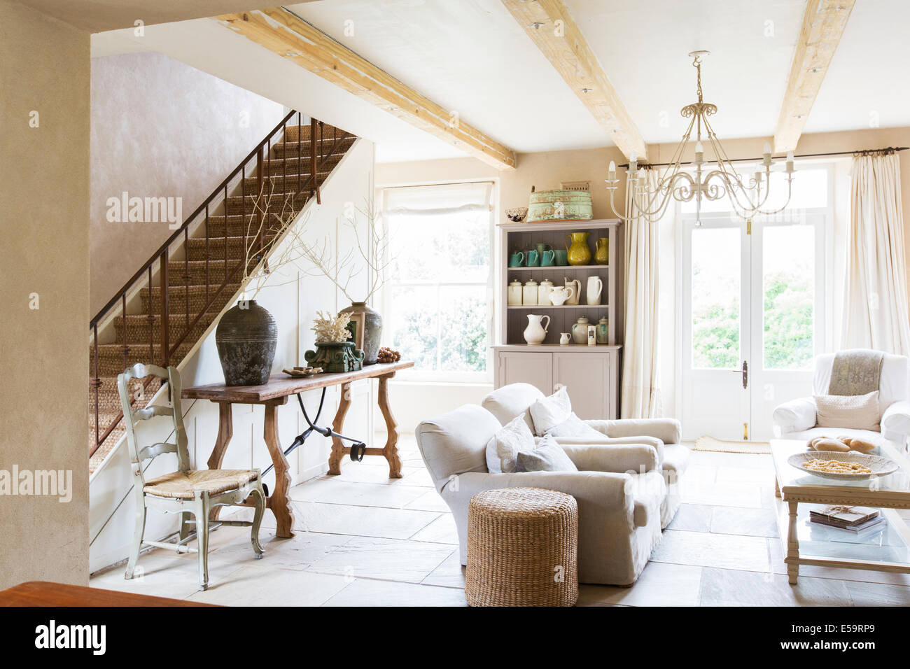 Sofas and staircase in modern living room Stock Photo Alamy