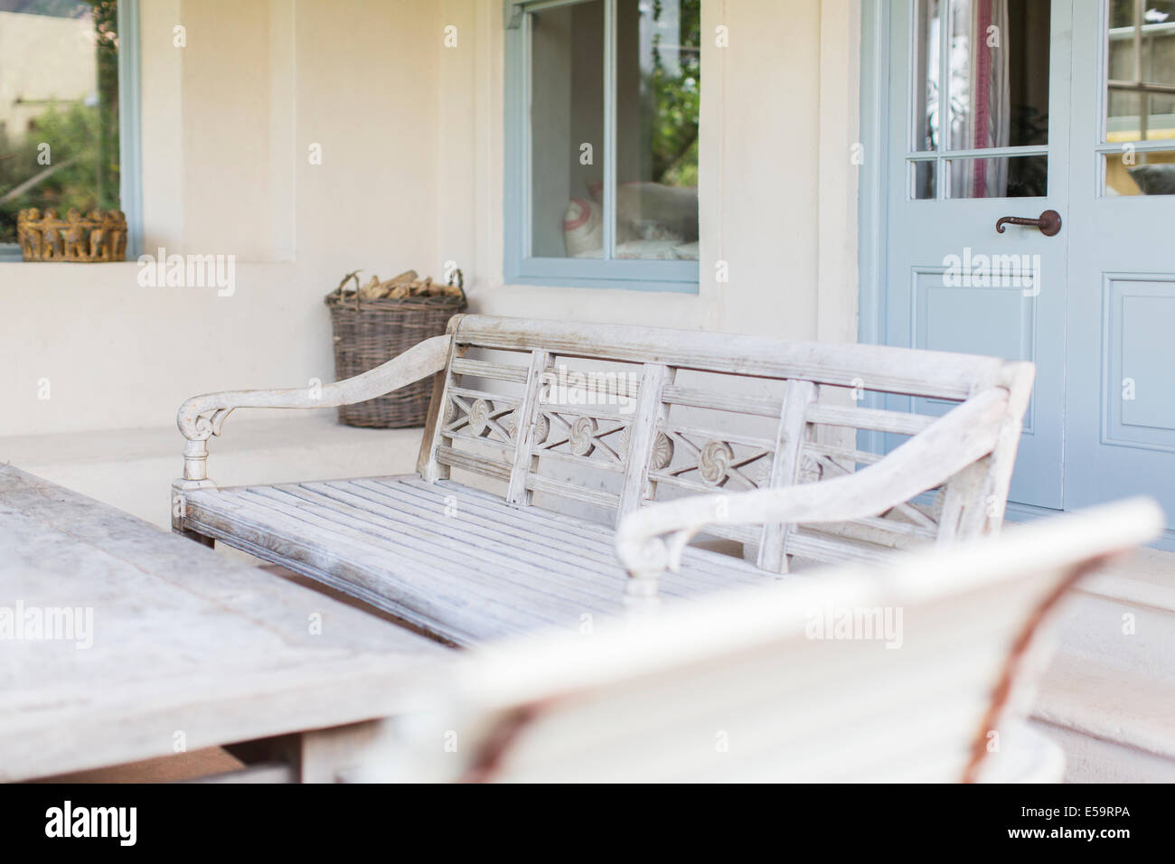 Bench and table in modern backyard Stock Photo