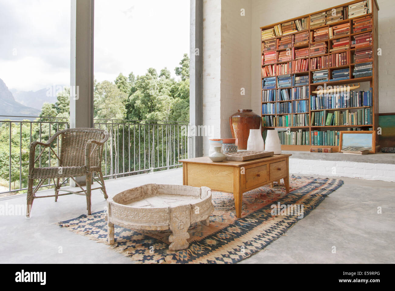 Bookcase and coffee table in modern house Stock Photo Alamy