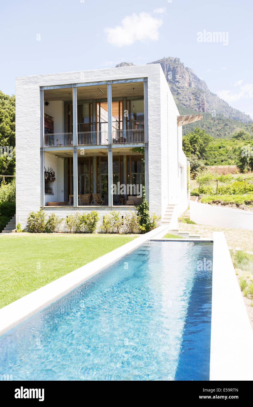 Modern house with swimming pool in rural landscape Stock Photo